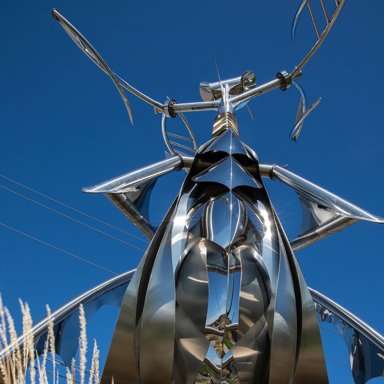 Large metal sculpture with blue sky